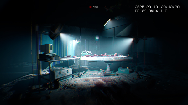 Screenshot aus Spie It reaches. Operationsraum mit Bildschirm und Liege.